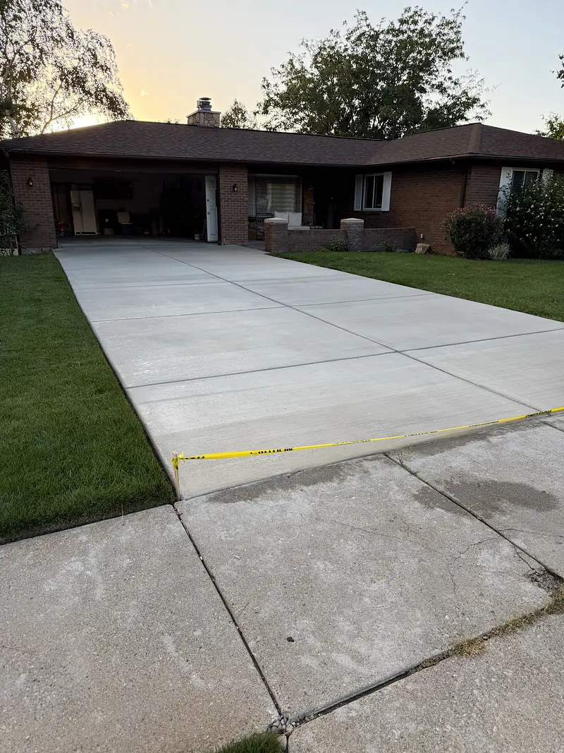 Freshly sealed driveway taped off while it cures